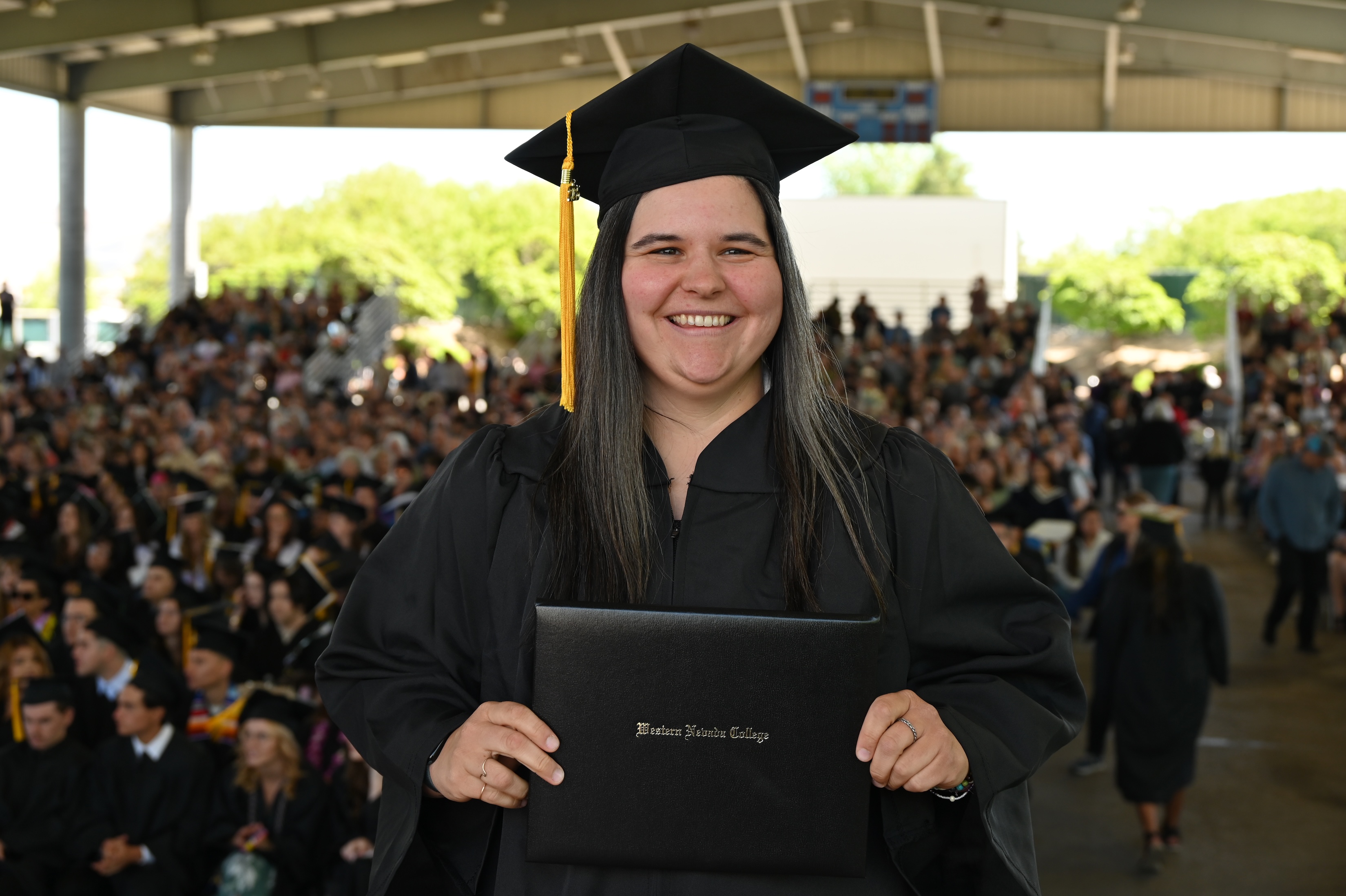 Brittney Schell, a testament to the power of lifelong learning, graduated on May 19 with honors from WNC's Bachelor’s degree program in Organization Project Management.