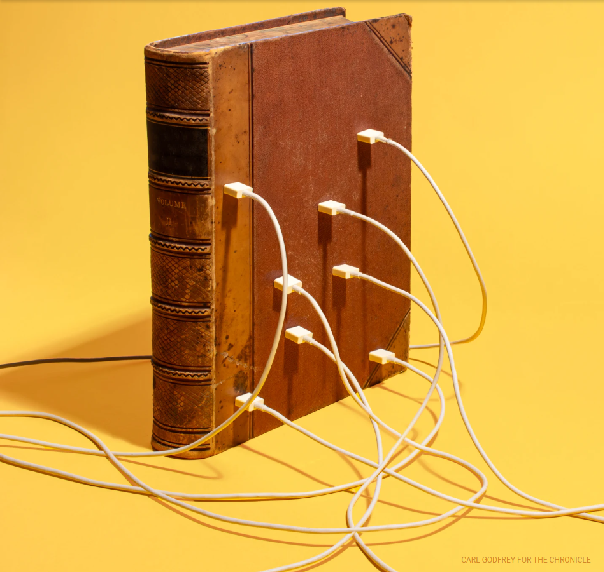 A book acting as an electrical outlet with multiple USB chargers plugged into it