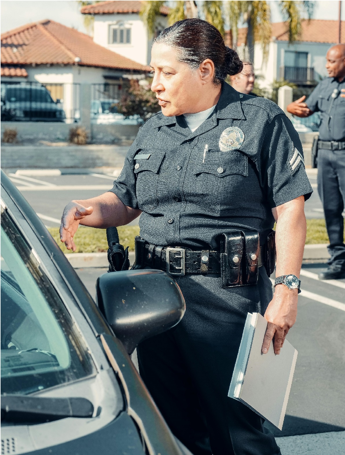A police officer talking to someone in a car